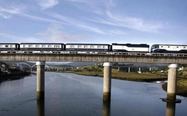 Un tren pasando sobre un río.