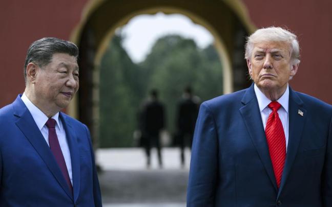 Trump, junto a Xi Jinping en su visita a China.