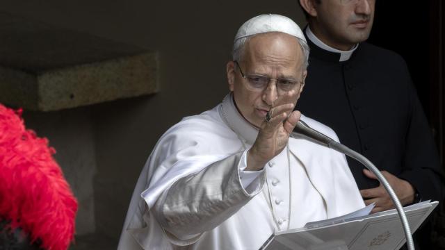 Pope Leon XIV delivers his Angelus prayer from Castel Gandolfo, where he is spending his summer holidays, flanked by his personal secretary, Father Edgard Iván Rimaycuna Inga.