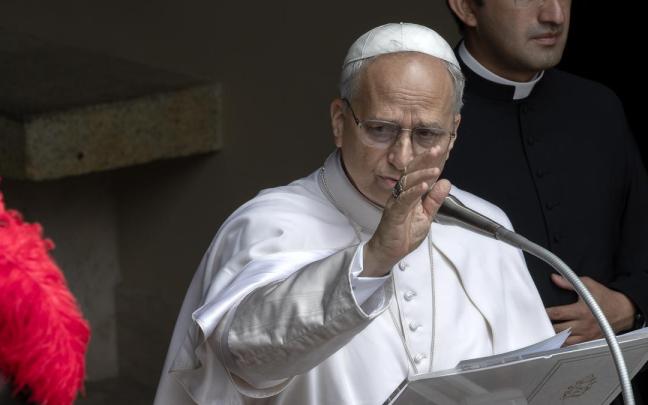 Pope Leon XIV delivers his Angelus prayer from Castel Gandolfo, where he is spending his summer holidays, flanked by his personal secretary, Father Edgard Iván Rimaycuna Inga.