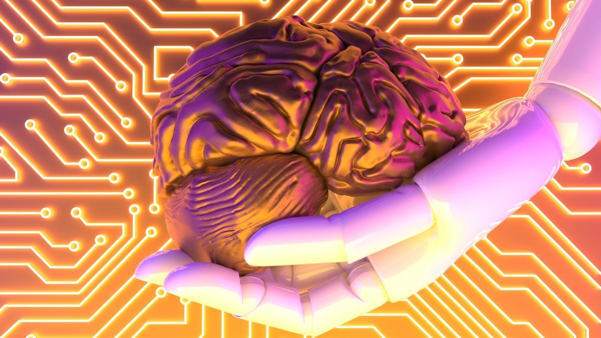 Una mano robótica sujeta una recreación de un cerebro humano.