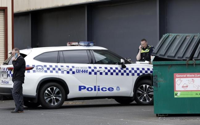 Policias australianos junto a su coche patrulla. Policias australianos junto a su coche patrulla.