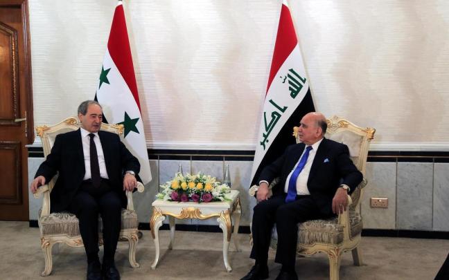 El ministro sirio de Asuntos Exteriores, Faisal al Miqdad, y su homólogo iraquí, Fuad Husein. El ministro sirio de Asuntos Exteriores, Faisal al Miqdad, y su homólogo iraquí, Fuad Husein.