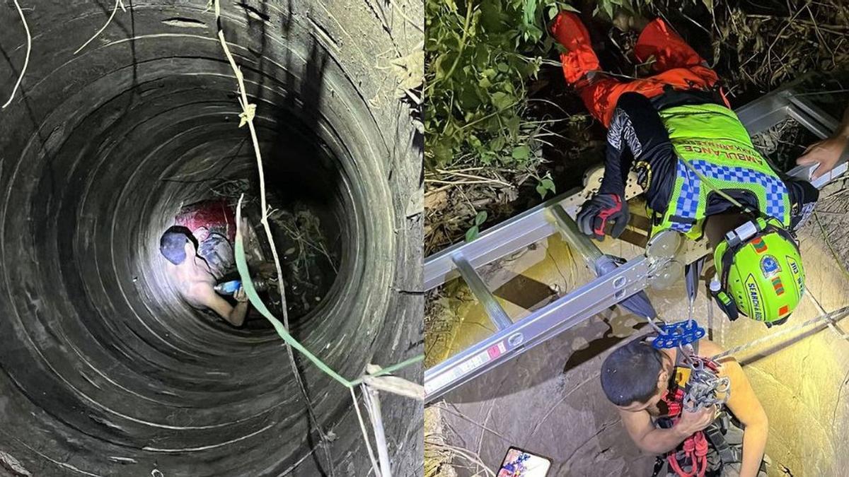 Los rescatadores, tratando de sacar al joven del pozo.