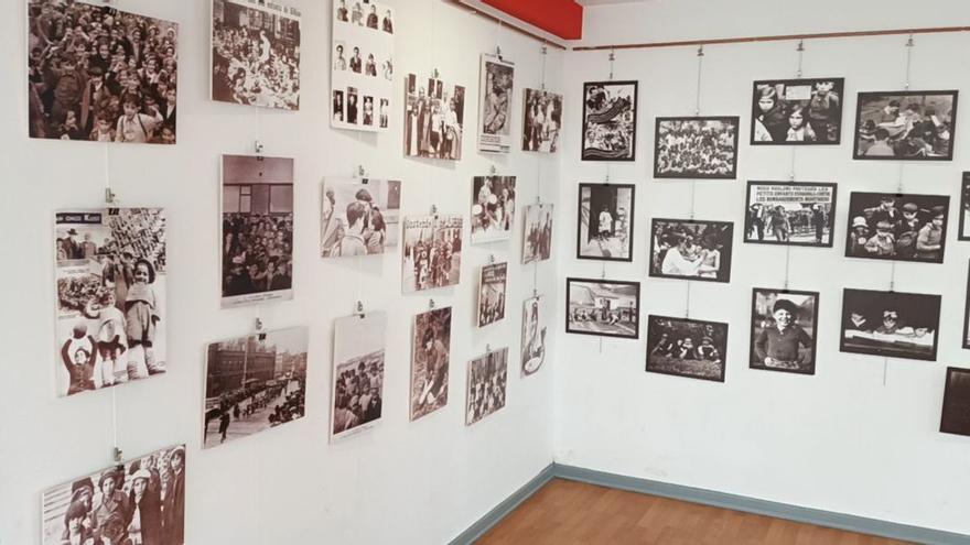 Paneles de la exposición repletos de instantáneas que reivindican la memoria de estos pequeños y pequeñas.