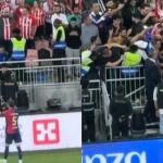 Iñigo Martínez se acerca a los aficionados del Athletic para intercambia su camiseta por la ikurriña