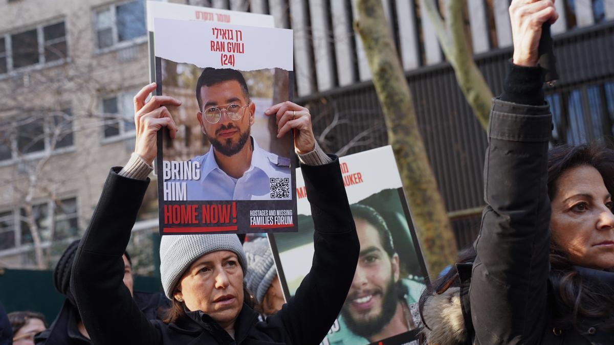 A woman holds a poster with the image of Ran Gvili, an Israeli hostage, during a rally demanding for the release of Israeli hostages kidnapped by Hamas at Dag Hammarskjold Plaza outside of the UN Headquarters. January 12th marks the 100th day of said host
