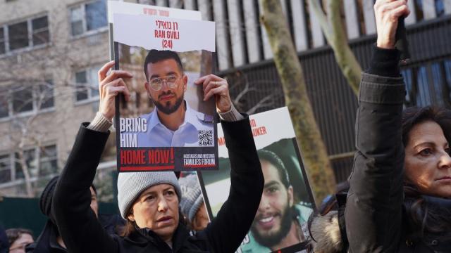 A woman holds a poster with the image of Ran Gvili, an Israeli hostage, during a rally demanding for the release of Israeli hostages kidnapped by Hamas at Dag Hammarskjold Plaza outside of the UN Headquarters. January 12th marks the 100th day of said host