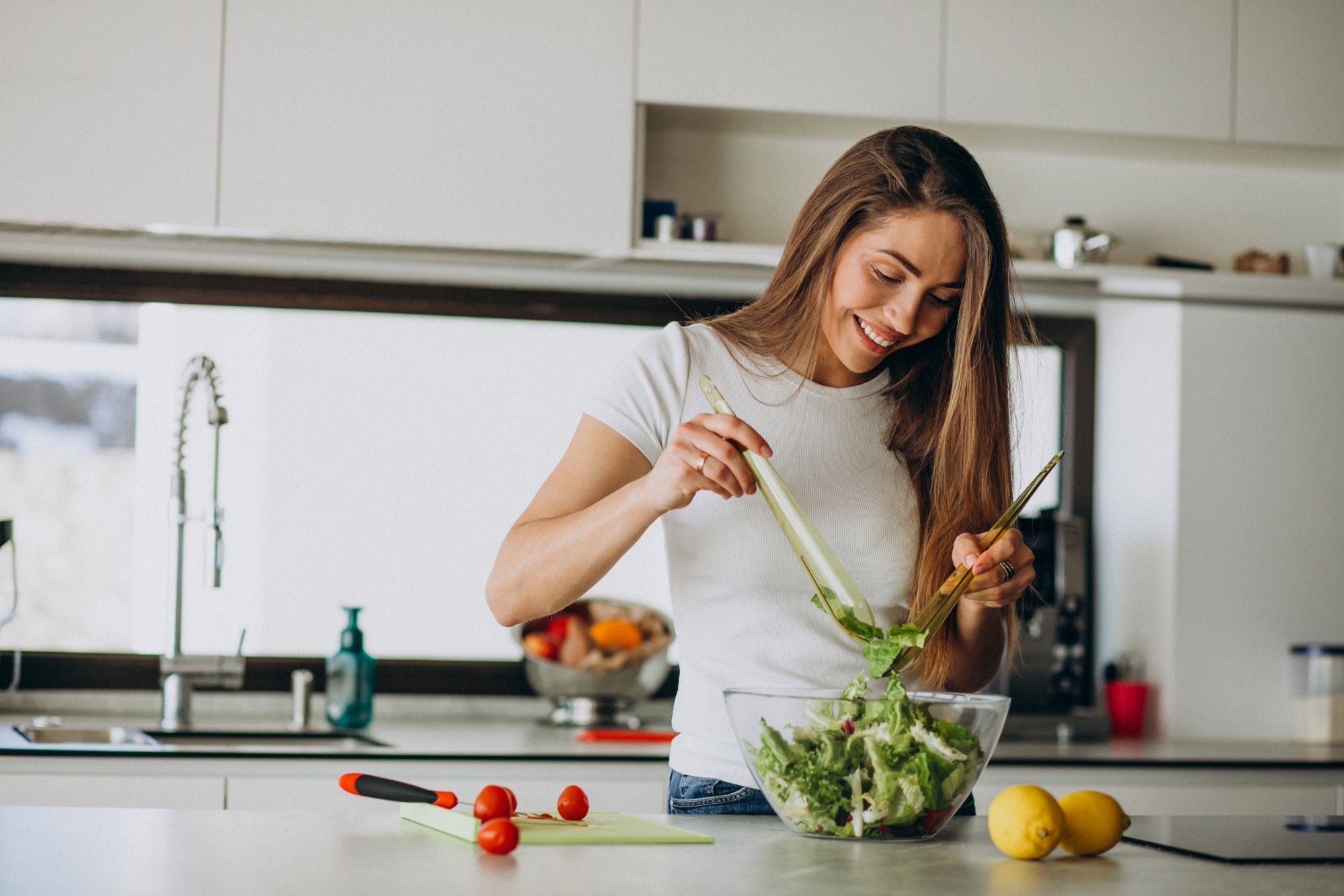 A Woman Prepares A Salad For Dinner.