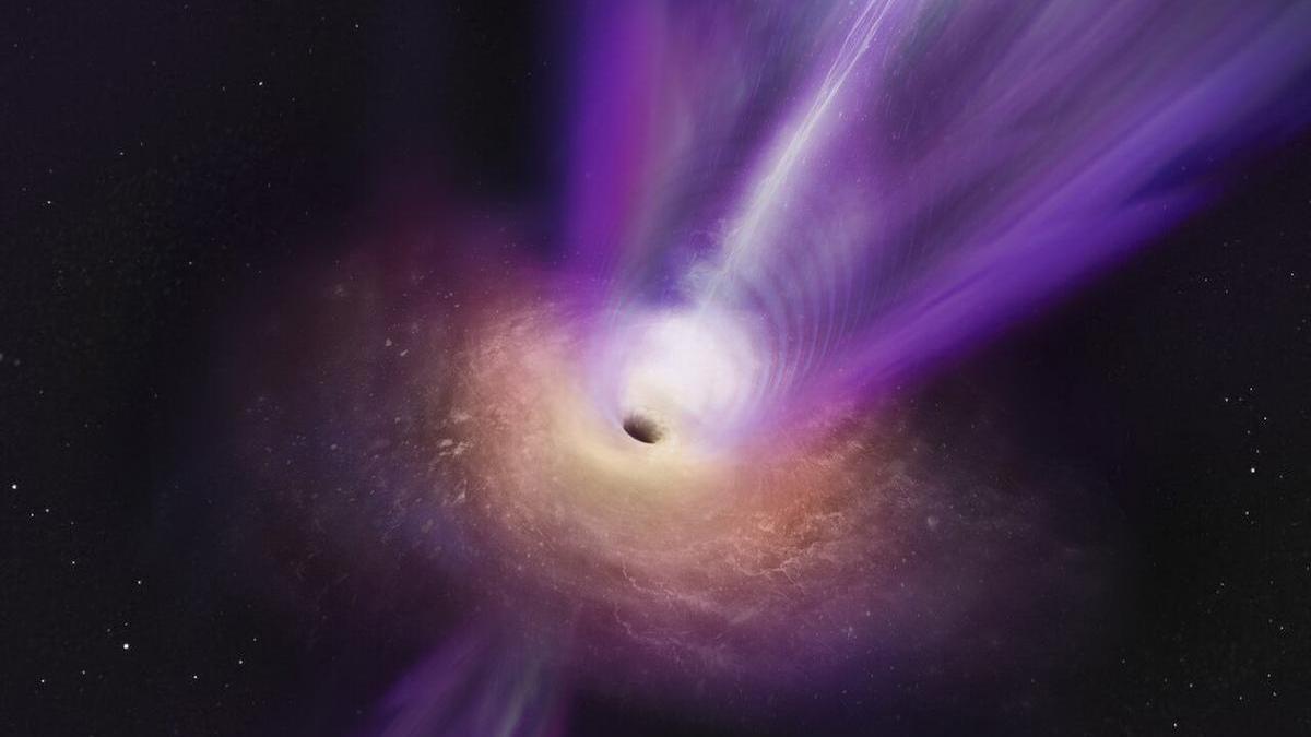 Representación artística en la que el chorro masivo del agujero negro se ve elevándose desde el centro.