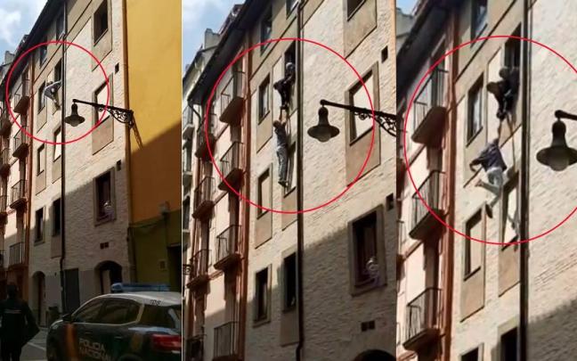 Imágenes de los agentes agarrando al hombre por los brazos en el edificio de Pamplona. DNN Imágenes de los agentes agarrando al hombre por los brazos en el edificio de Pamplona. DNN