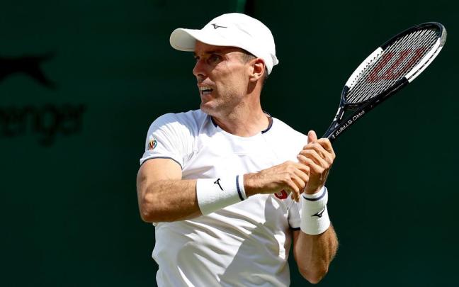 Bautista, durante el choque ante Fonseca en Wimbledon.