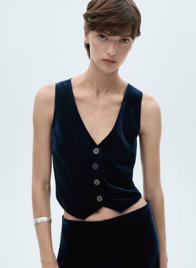 Chaleco de terciopelo azul, para un evento especial.