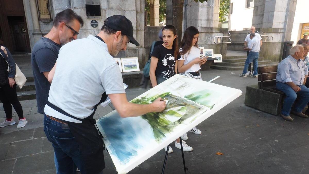 Plasmando en el lienzo una imagen del puente de Txankakua, a la sombra de la parroquia de San Bartolomé.