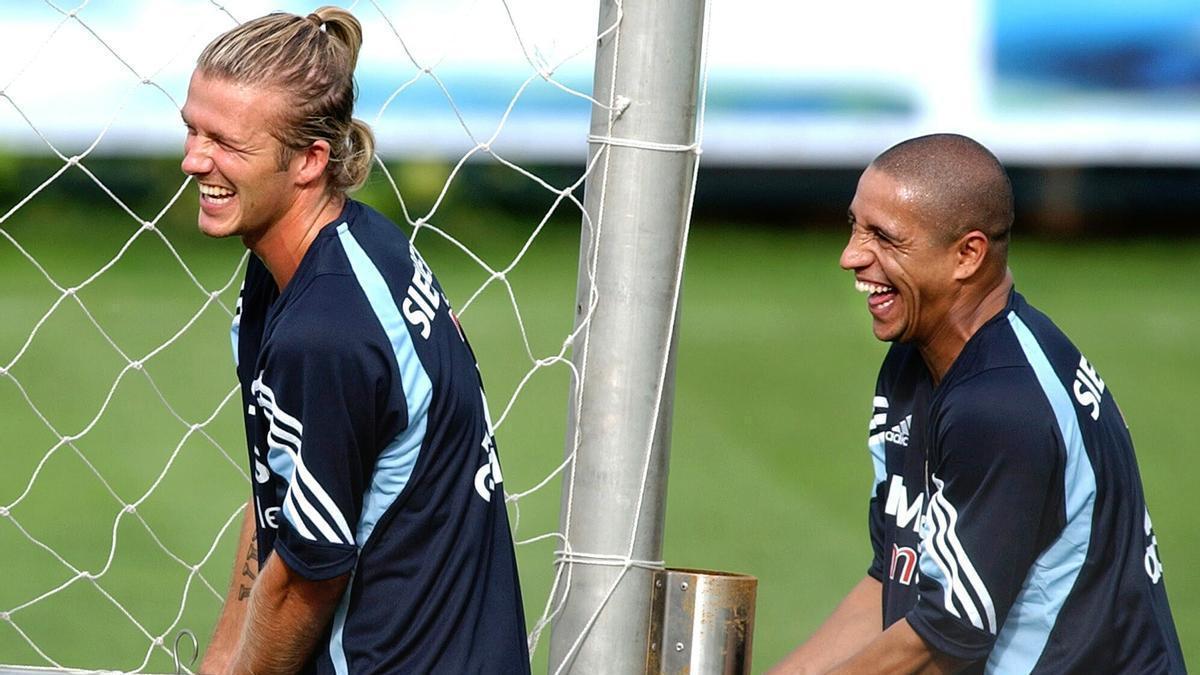 Beckham y Roberto Carlos, durante un entrenamiento con el Real Madrid.