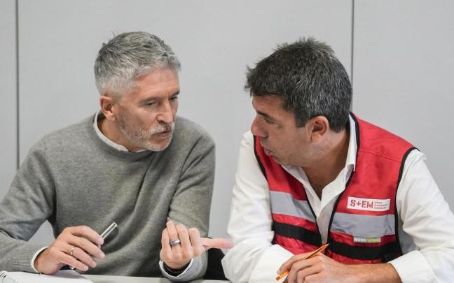 El ministro de Interior, Fernando Grande-Marlaska, y el 'president' de la Generalitat, Carlos Mazón, durante la reunión del CECOPI por la DANA en la Comunitat Valenciana